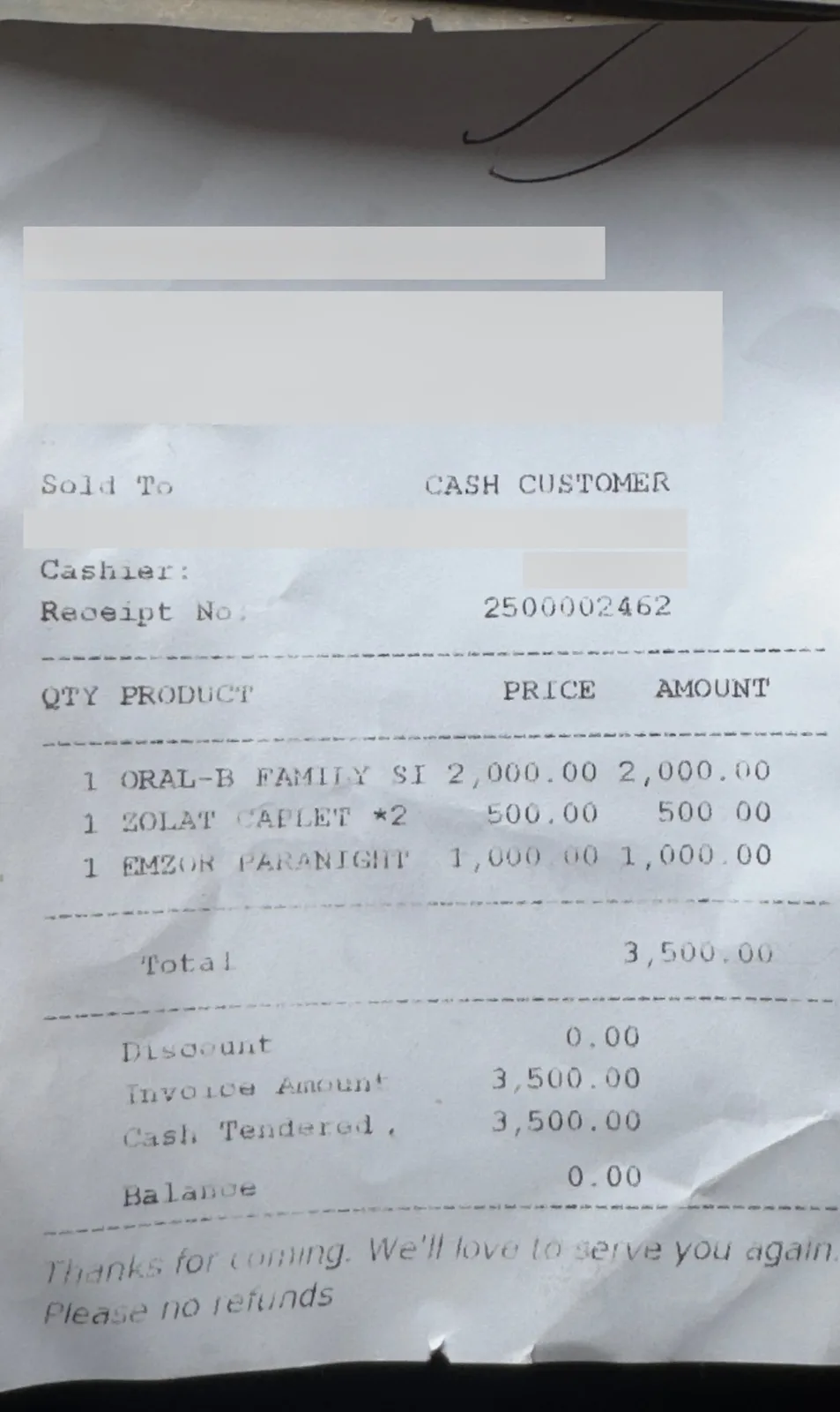 The pharmacy receipt with the store name, phone lines, date and cashier covered by grey bars. Three item lines, the total and the receipt number can be read.